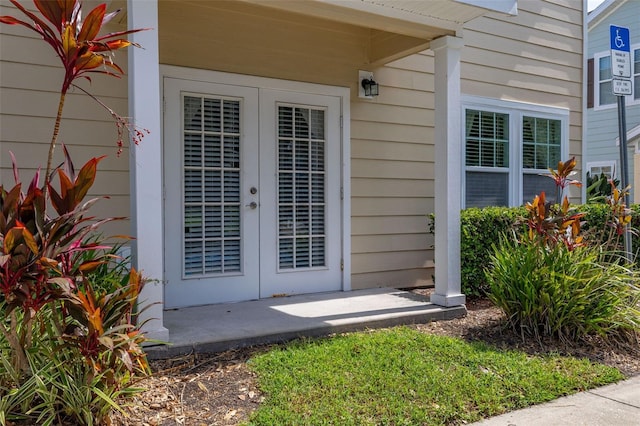 5372 Diplomat Ct Unit 108, Kissimmee, FL 34746 - view of exterior entry featuring french doors