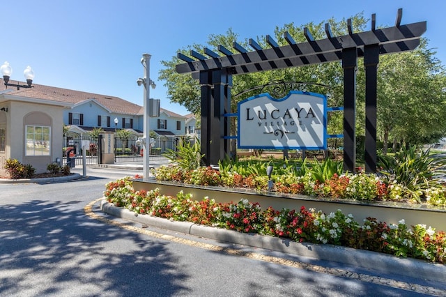5372 Diplomat Ct Unit 108, Kissimmee, FL 34746 - community / neighborhood sign with a gate and a residential view