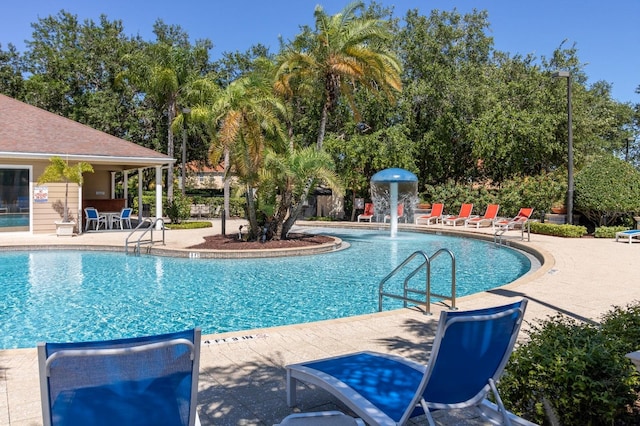 5372 Diplomat Ct Unit 108, Kissimmee, FL 34746 - community pool featuring a patio
