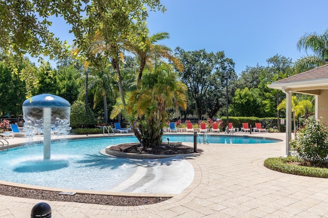 5372 Diplomat Ct Unit 108, Kissimmee, FL 34746 - community pool with a patio area and view of wooded area