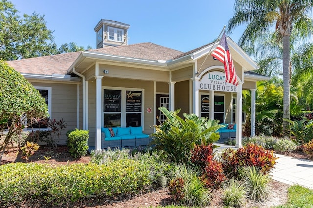 5372 Diplomat Ct Unit 108, Kissimmee, FL 34746 - view of front of house featuring a porch and a shingled roof
