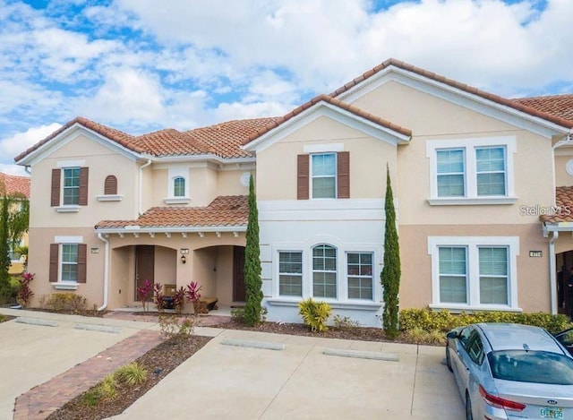 4710 Terrasonesta Dr, Davenport, FL 33837 - mediterranean / spanish home featuring a tile roof and stucco siding