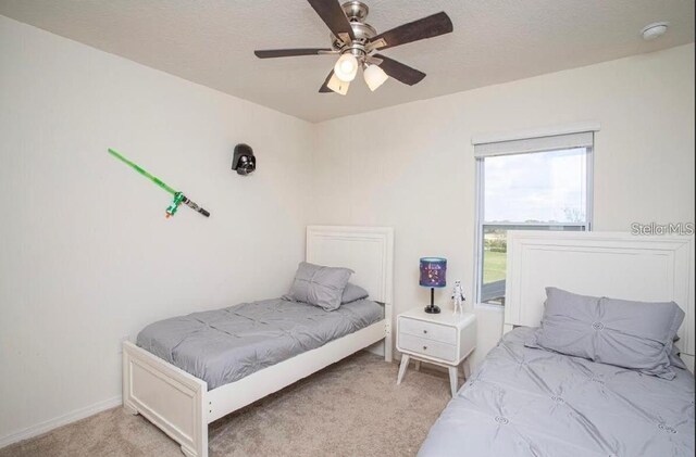 4710 Terrasonesta Dr, Davenport, FL 33837 - bedroom featuring light carpet and a ceiling fan