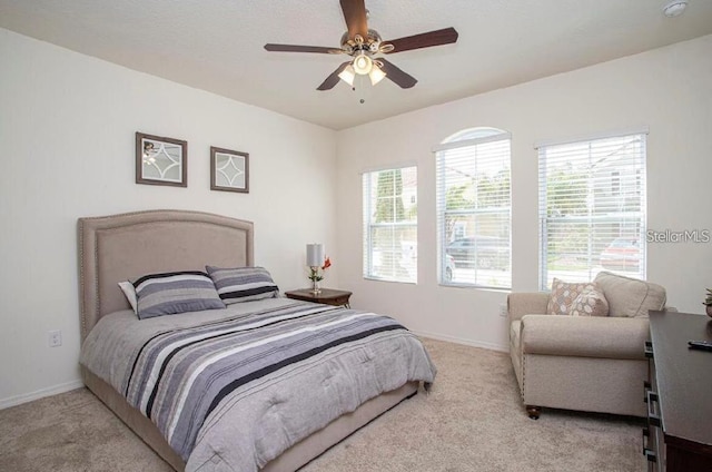 4710 Terrasonesta Dr, Davenport, FL 33837 - carpeted bedroom with baseboards and ceiling fan