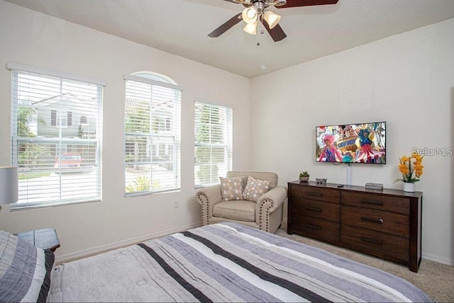 4710 Terrasonesta Dr, Davenport, FL 33837 - bedroom featuring multiple windows, ceiling fan, and light colored carpet