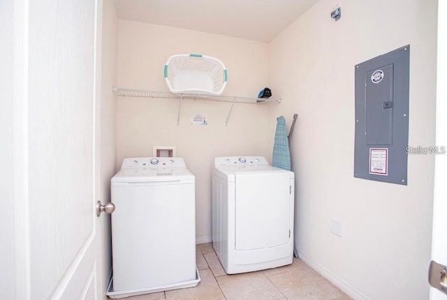 4710 Terrasonesta Dr, Davenport, FL 33837 - washroom with electric panel, washing machine and clothes dryer, and light tile patterned flooring
