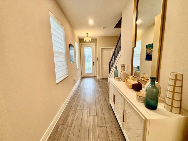 1399 Greenfield Loop, Kissimmee, FL 34747 - doorway featuring wood-type flooring and stairway