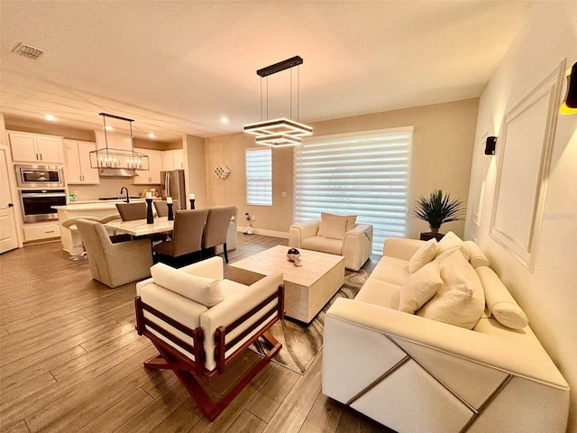 1399 Greenfield Loop, Kissimmee, FL 34747 - living area with dark wood finished floors and recessed lighting