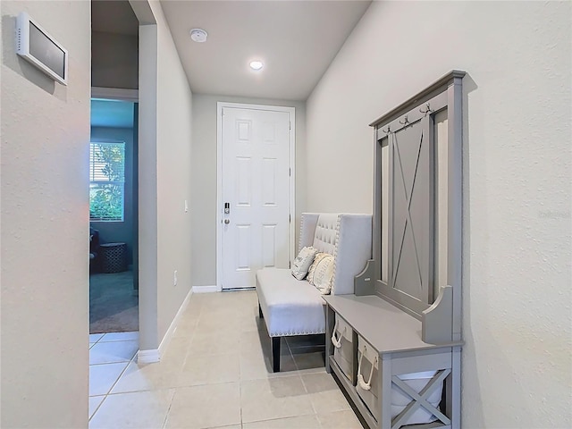 509 Mckenna Dr, Winter Haven, FL 33881 - mudroom featuring light tile patterned floors and baseboards