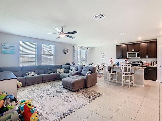 509 Mckenna Dr, Winter Haven, FL 33881 - living room with light tile patterned floors, ceiling fan, and recessed lighting