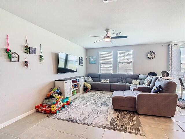 509 Mckenna Dr, Winter Haven, FL 33881 - living area featuring light tile patterned flooring and a ceiling fan