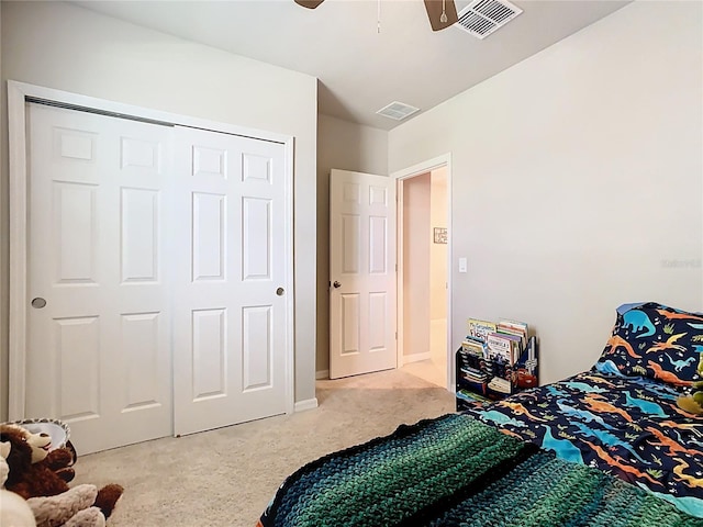 509 Mckenna Dr, Winter Haven, FL 33881 - bedroom featuring light carpet, ceiling fan, and a closet