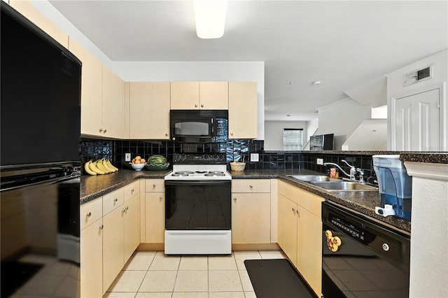 742 Centervale Dr Unit 742, Celebration, FL 34747 - kitchen with black appliances, tasteful backsplash, dark countertops, light tile patterned floors, and light brown cabinetry