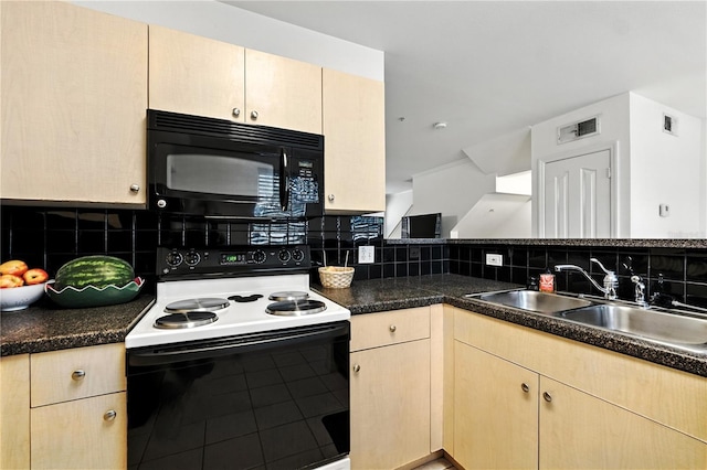 742 Centervale Dr Unit 742, Celebration, FL 34747 - kitchen with range with electric stovetop, black microwave, light brown cabinetry, and decorative backsplash