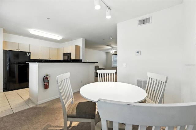 742 Centervale Dr Unit 742, Celebration, FL 34747 - dining area with light carpet, light tile patterned flooring, and a ceiling fan