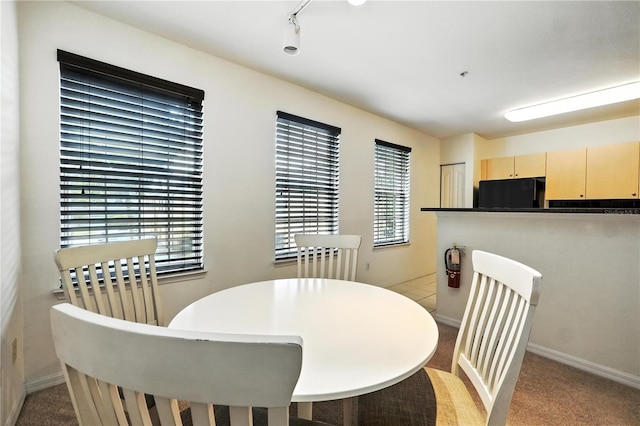 742 Centervale Dr Unit 742, Celebration, FL 34747 - dining room featuring light carpet and baseboards