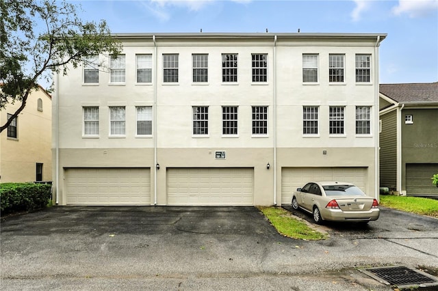 742 Centervale Dr Unit 742, Celebration, FL 34747 - view of property with a garage and driveway