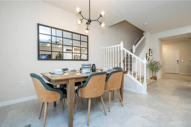 4254 Lana Ave, Davenport, FL 33897 - dining area with stairway, a chandelier, and light tile patterned floors