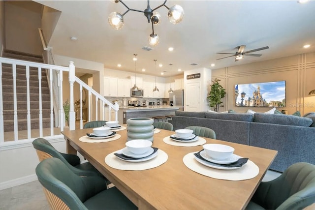 4254 Lana Ave, Davenport, FL 33897 - dining space featuring stairway, a ceiling fan, and recessed lighting