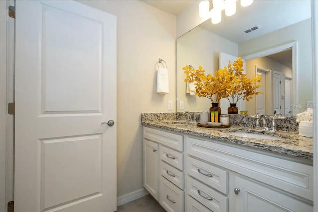 4254 Lana Ave, Davenport, FL 33897 - bathroom featuring double vanity and a chandelier