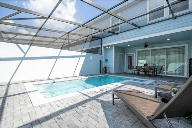4254 Lana Ave, Davenport, FL 33897 - outdoor pool featuring a patio area, ceiling fan, outdoor dining space, and a lanai