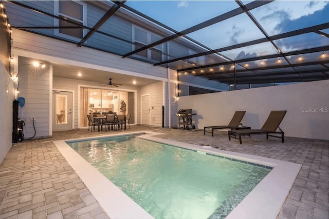 4254 Lana Ave, Davenport, FL 33897 - view of pool with a patio area, ceiling fan, outdoor dining space, and glass enclosure