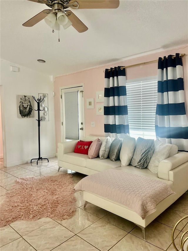 712 Cockatoo Ct, Kissimmee, FL 34759 - living room featuring a ceiling fan and light tile patterned flooring