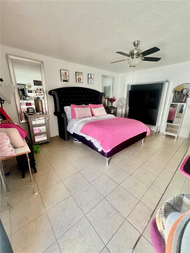 712 Cockatoo Ct, Kissimmee, FL 34759 - bedroom with light tile patterned floors, a textured ceiling, and ceiling fan