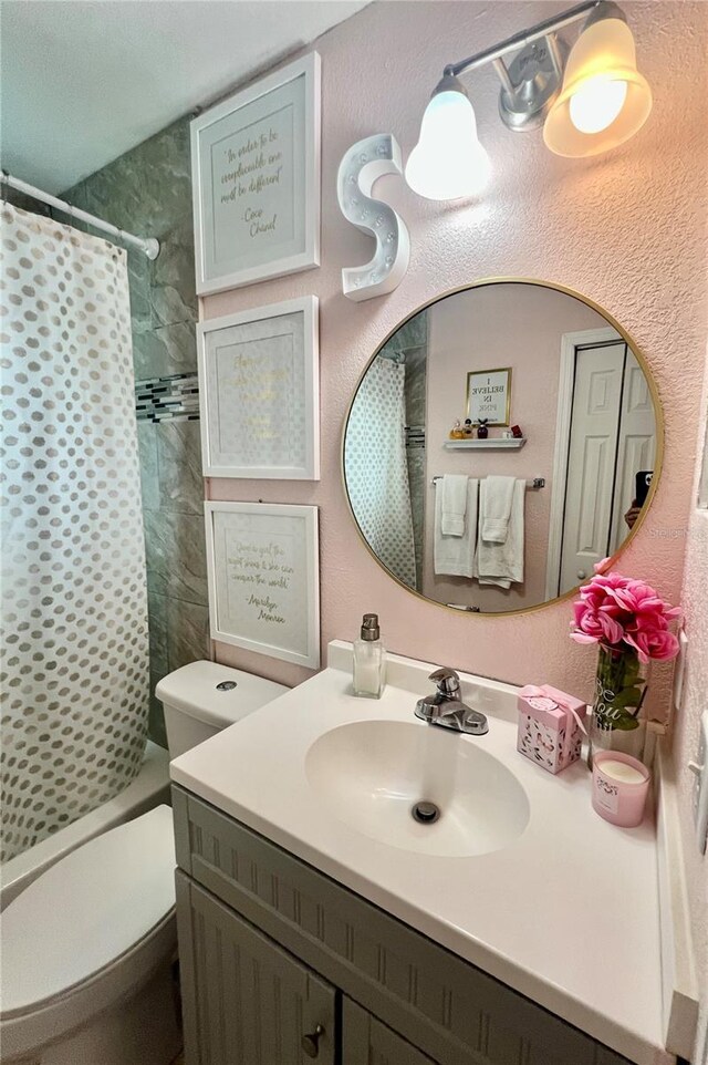 712 Cockatoo Ct, Kissimmee, FL 34759 - bathroom featuring vanity and a shower with shower curtain