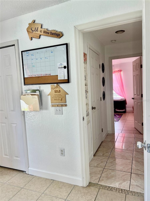 712 Cockatoo Ct, Kissimmee, FL 34759 - hallway featuring baseboards