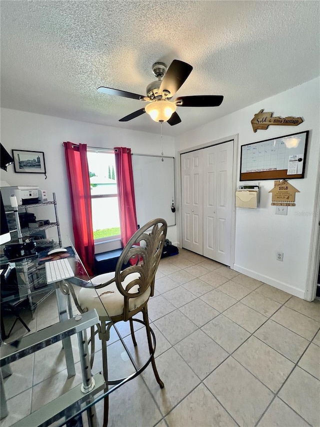 712 Cockatoo Ct, Kissimmee, FL 34759 - home office with a ceiling fan, a textured ceiling, and light tile patterned floors