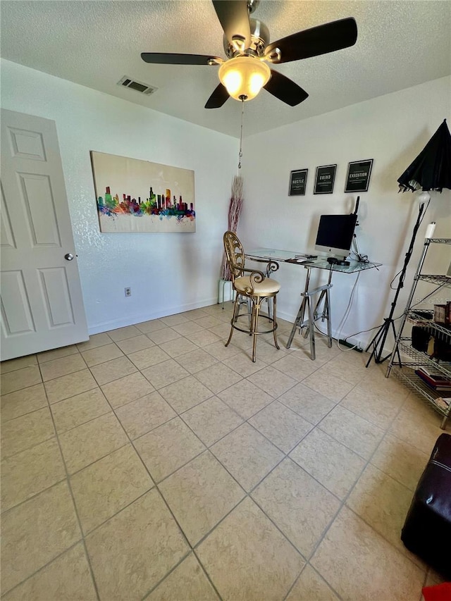 712 Cockatoo Ct, Kissimmee, FL 34759 - home office with a textured ceiling, a ceiling fan, and tile patterned floors