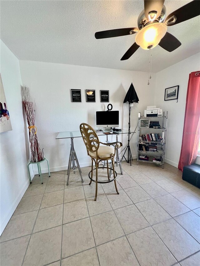 712 Cockatoo Ct, Kissimmee, FL 34759 - home office featuring light tile patterned floors, a ceiling fan, and a textured ceiling
