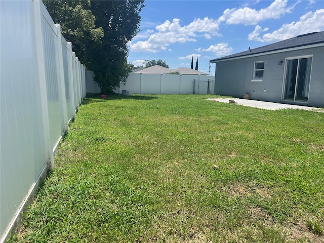 712 Cockatoo Ct, Kissimmee, FL 34759 - fenced backyard with a patio area