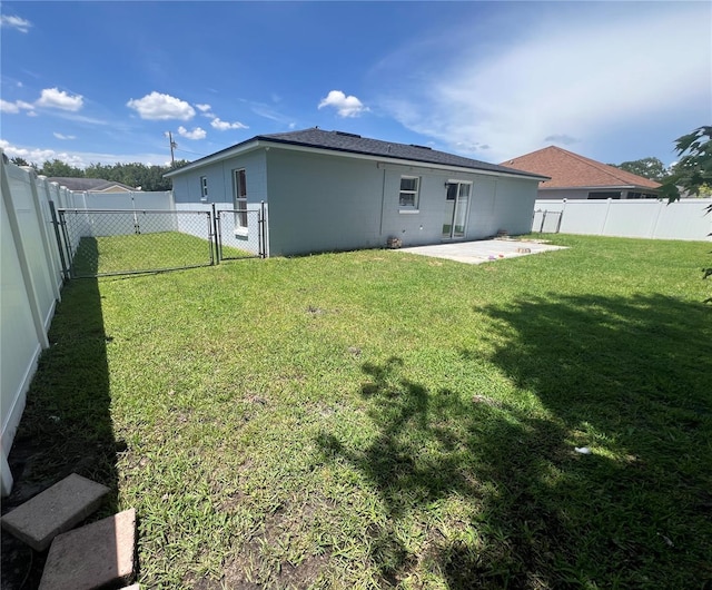 712 Cockatoo Ct, Kissimmee, FL 34759 - back of house with a gate, a patio, and a fenced backyard