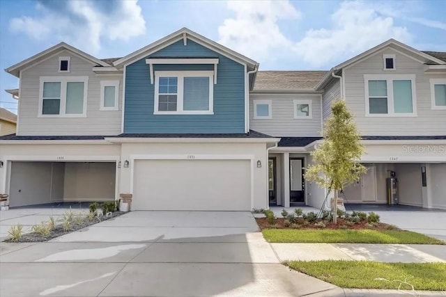 1851 Terrapin Rd, Ocoee, FL 34761 - view of front facade with an attached garage, concrete driveway, and roof with shingles