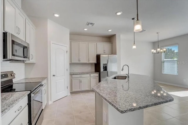 1851 Terrapin Rd, Ocoee, FL 34761 - kitchen featuring stainless steel appliances, a chandelier, light tile patterned flooring, pendant lighting, and recessed lighting