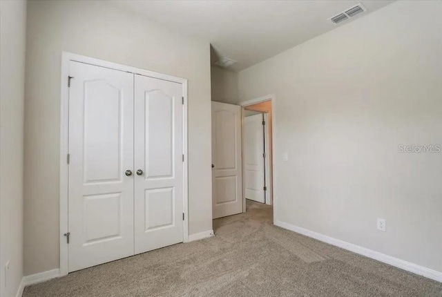 1851 Terrapin Rd, Ocoee, FL 34761 - unfurnished bedroom featuring light colored carpet and a closet