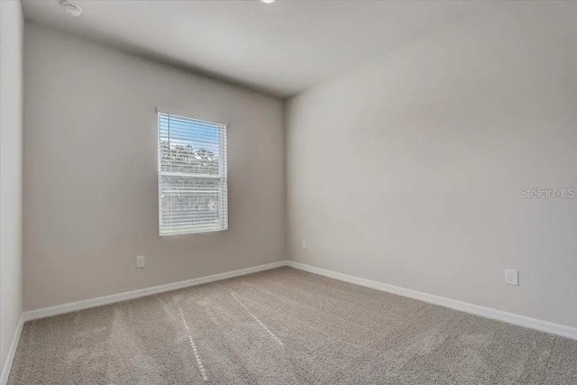 1851 Terrapin Rd, Ocoee, FL 34761 - unfurnished room with carpet flooring and a smoke detector