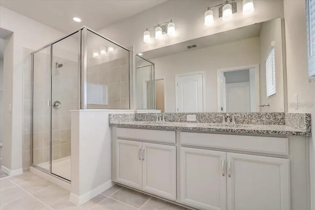 1851 Terrapin Rd, Ocoee, FL 34761 - full bathroom featuring double vanity, a shower stall, and tile patterned flooring