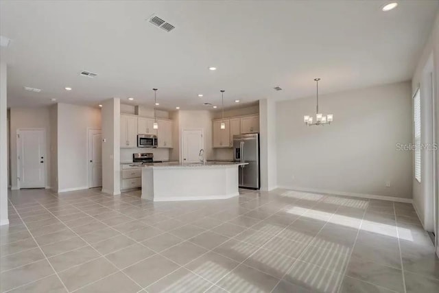 1851 Terrapin Rd, Ocoee, FL 34761 - kitchen with stainless steel appliances, open floor plan, light tile patterned floors, a chandelier, and recessed lighting