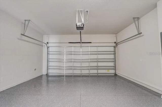 1851 Terrapin Rd, Ocoee, FL 34761 - garage featuring a garage door opener and baseboards