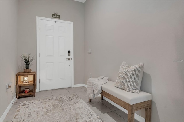 2661 Grasmere View Pkwy, Kissimmee, FL 34746 - foyer with light tile patterned flooring and baseboards