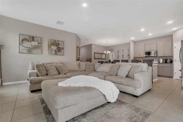 2661 Grasmere View Pkwy, Kissimmee, FL 34746 - living area with a chandelier, light tile patterned floors, and recessed lighting