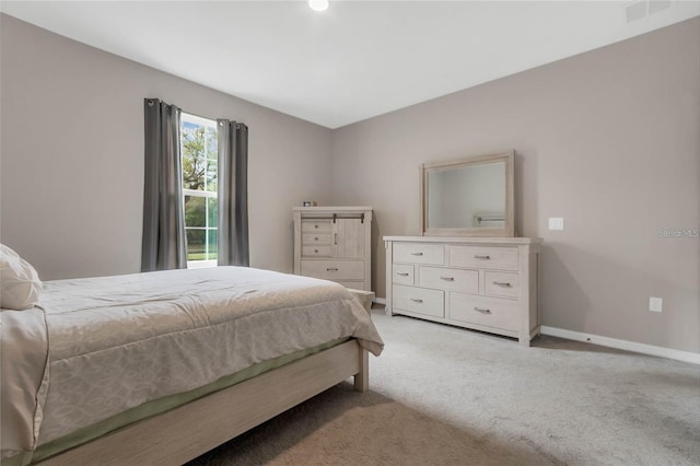 2661 Grasmere View Pkwy, Kissimmee, FL 34746 - bedroom with baseboards and light colored carpet