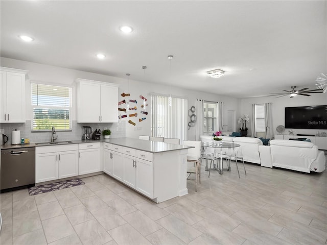 681 Pebble Beach Dr, Davenport, FL 33896 - kitchen featuring stainless steel dishwasher, a peninsula, healthy amount of natural light, a ceiling fan, and recessed lighting