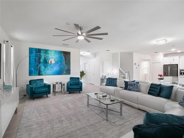 681 Pebble Beach Dr, Davenport, FL 33896 - living area featuring a ceiling fan and stairs
