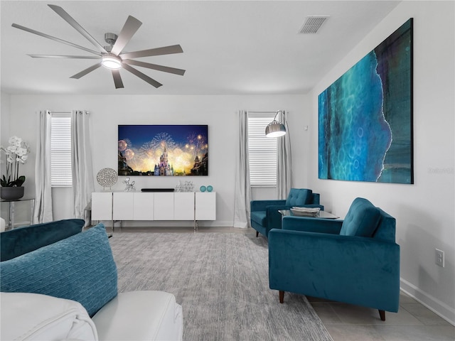 681 Pebble Beach Dr, Davenport, FL 33896 - living room with a ceiling fan and baseboards
