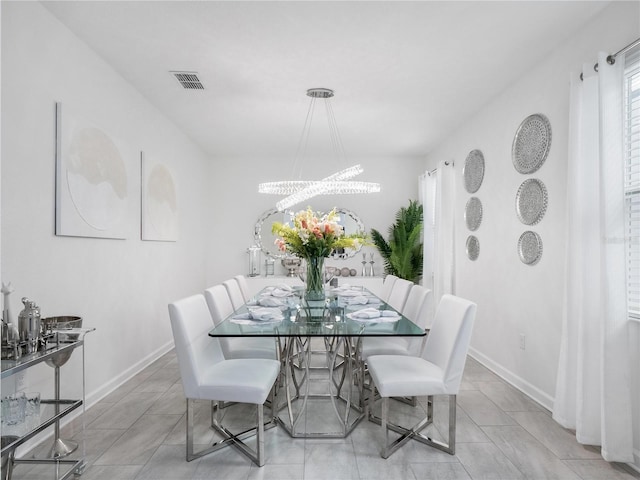 681 Pebble Beach Dr, Davenport, FL 33896 - dining space featuring a chandelier and tile patterned floors