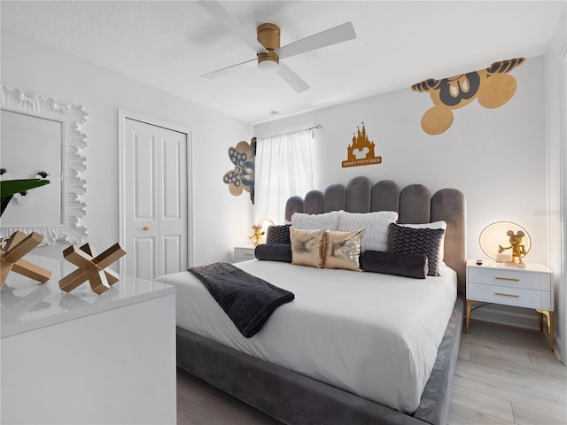 681 Pebble Beach Dr, Davenport, FL 33896 - bedroom with a closet, ceiling fan, and light wood-style flooring